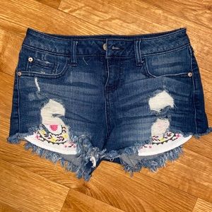 Francesca’s denim shorts with pocket detail